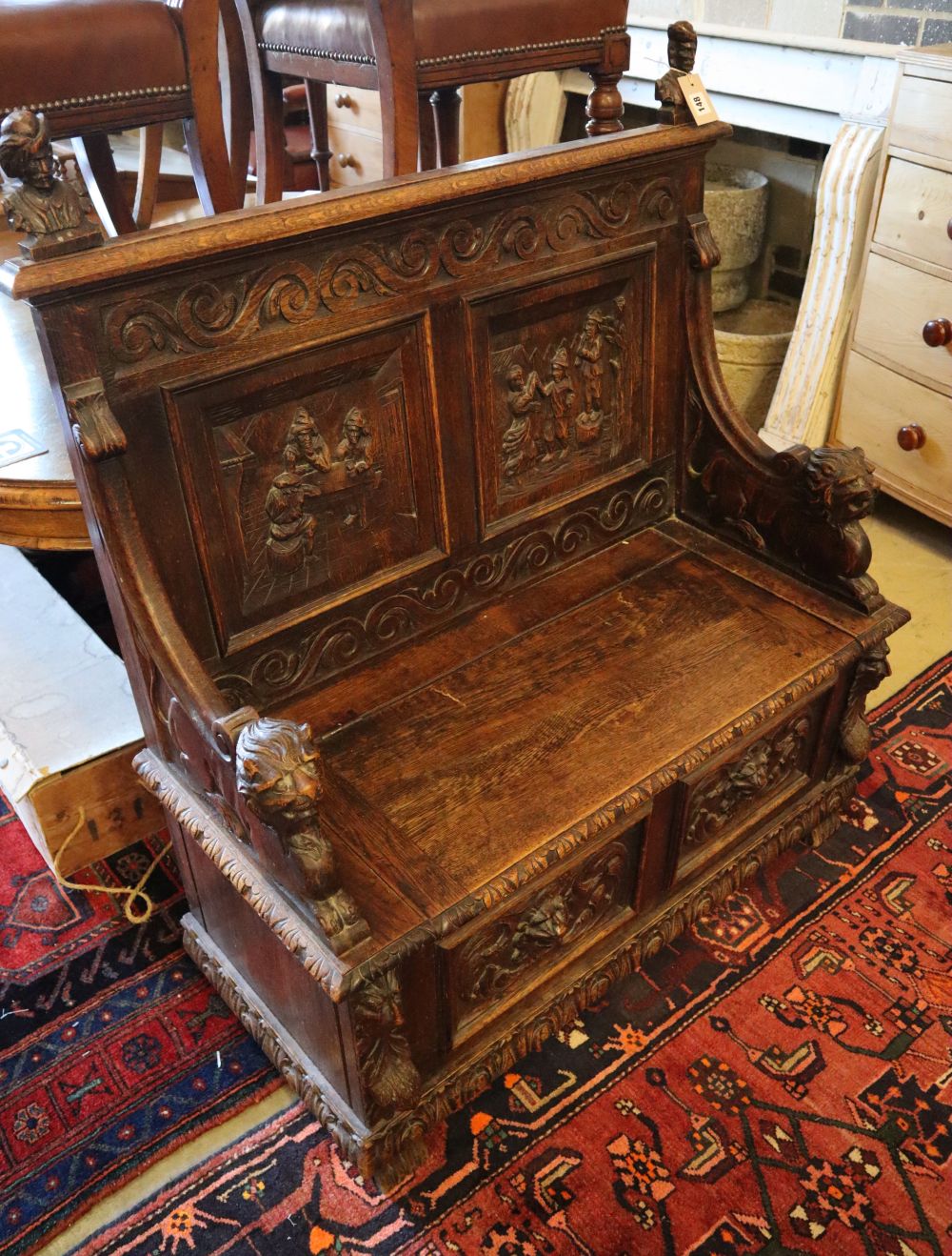 A late 19th century French carved box seat settle, width 100cm, depth 45cm, height 116cm